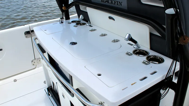 Slide: The Image of Spacious Aft Deck Workstation The aft deck of the 2020 Blackfin 332 Center Console features a sleek and functional workstation. Equipped with multiple rod holders, cup holders, and a high-quality surface, it's perfect for preparing bait or managing a catch. The sophisticated design an - 6687438