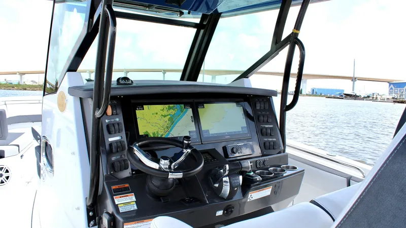 Slide: The Image of Helm Station of Blackfin 332 The helm station of the 2020 Blackfin 332 Center Console features state-of-the-art navigation technology with dual multifunction displays for precise control and ease of use. The ergonomic steering wheel and well-placed controls ensure a comfortable and e - 6687432