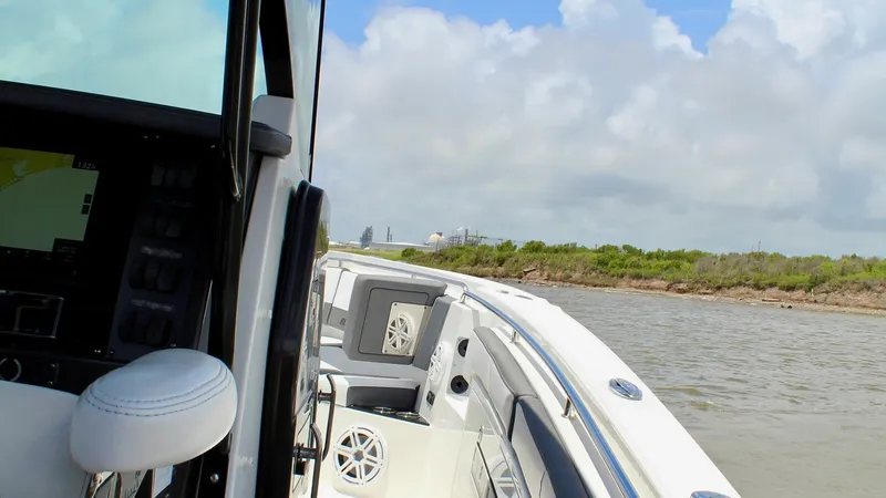 Slide: The Image of Starboard Side with Helm View This image showcases the starboard side of the 2020 Blackfin 332 Center Console, highlighting the helm area with its ergonomic seating and state-of-the-art navigation controls. The sleek design of the console ensures easy access to gauges and electronics, - 6687443
