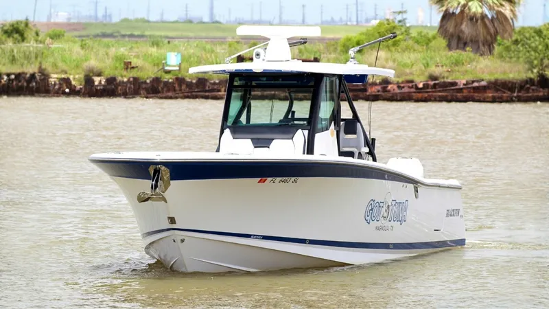 The Image of Bow View of Blackfin 332 Center Console The 2020 Blackfin 332 Center Console, 'Got Tuna,' is showcased in an impressive bow view. Its sleek hull design and distinctive lines reflect the vessel's robust performance capabilities. The boat's spacious deck and modern console are perfect for both fi - 6778437