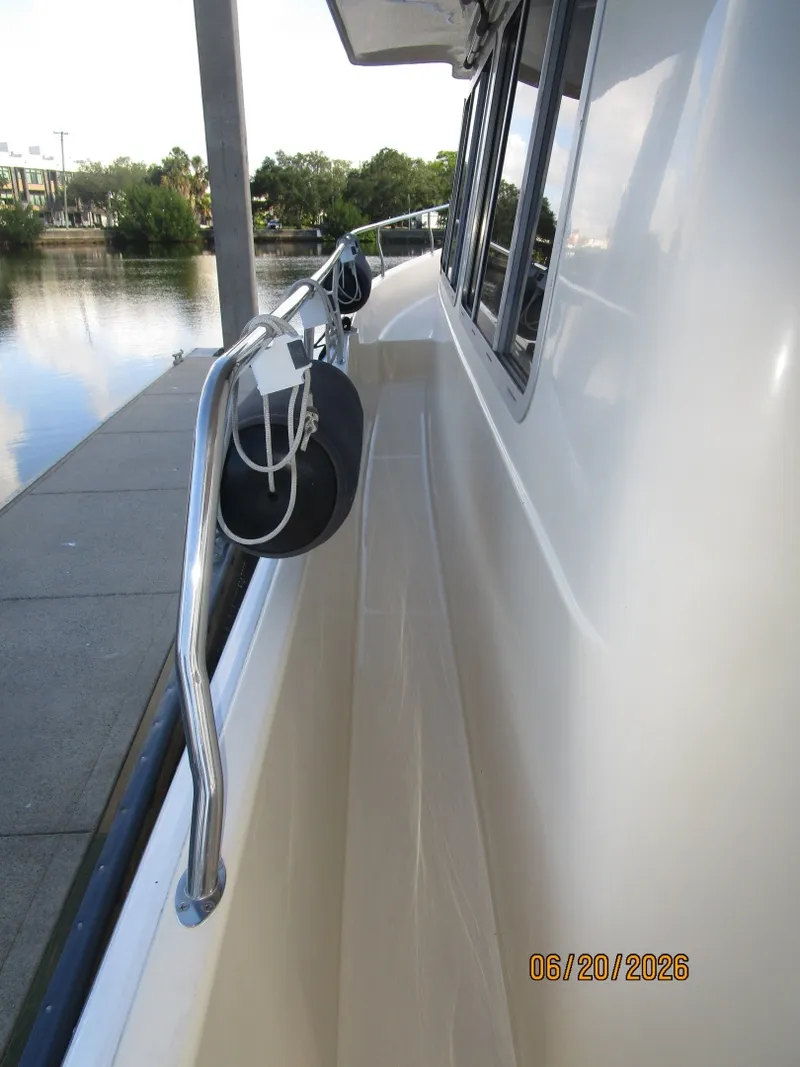 Slide: The Image of 40' Mainship port side deck1 - 6519945
