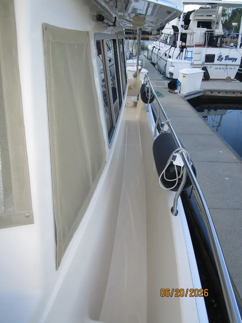Slide: The Image of 40' Mainship port side deck2 - 6519946