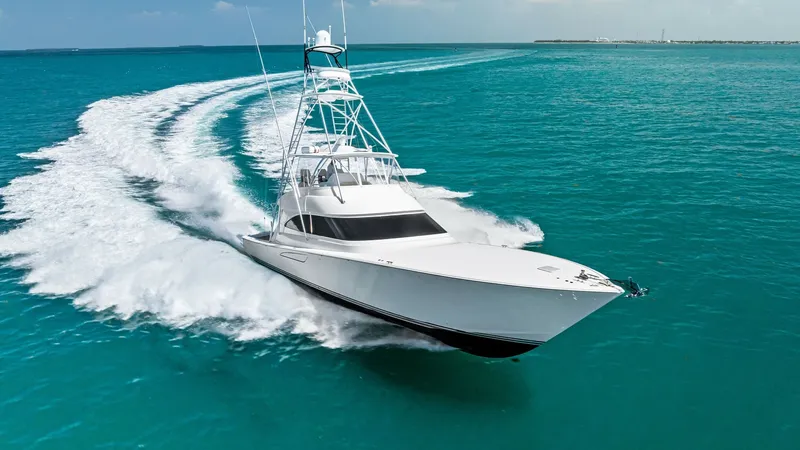 Slide: The Image of Dynamic Bow and Tower View Experience the power and elegance of the 2018 Viking 62 Convertible as it cuts through the azure waters. This image showcases the sleek bow and impressive tower structure, highlighting its superior design and craftsmanship. The vessel's aerodynamic profil - 8440113