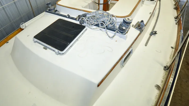 Slide: The Image of 1984 Bristol 41.1 | Petrel Yacht deck with ropes and hatch, showcasing classic nautical design. - 6523073
