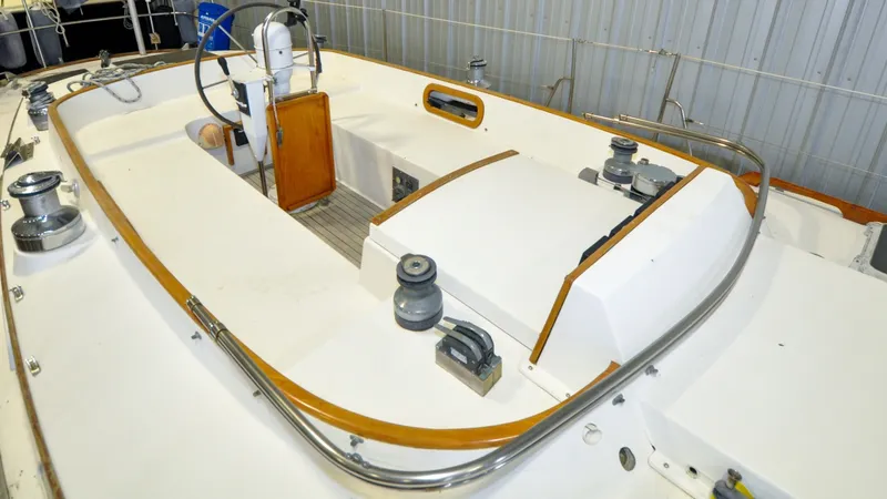 Slide: The Image of 1984 Bristol 41.1 | Petrel Yacht cockpit with steering wheel and winches, showcasing sleek design and functionality. - 6523043