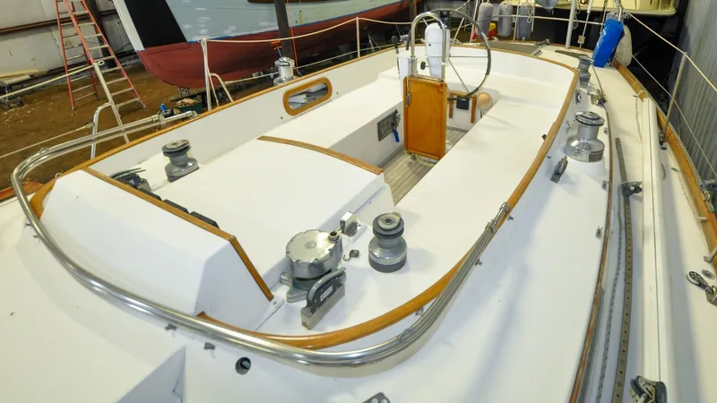 Slide: The Image of 1984 Bristol 41.1 | Petrel Sailboat cockpit with steering wheel and winches, showcasing classic design. - 6523044