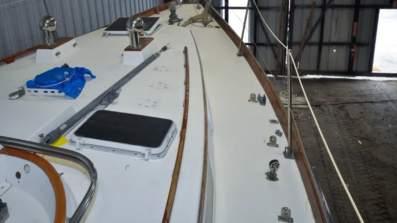 Slide: The Image of 1984 Bristol 41.1 | Petrel Yacht deck in a boatyard, featuring hardware and fittings. - 6523051