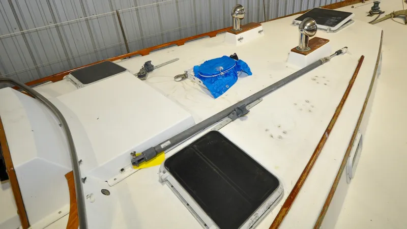 Slide: The Image of 1984 Bristol 41.1 | Petrel Yacht deck with equipment and blue tarp in storage. - 6523049