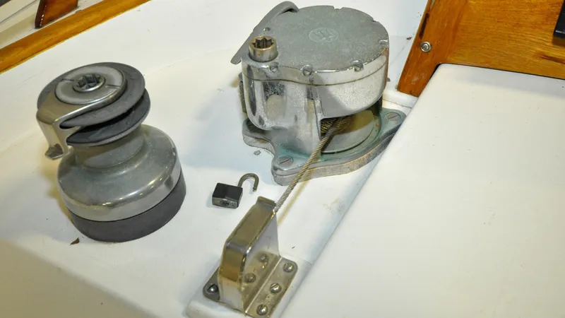 Slide: The Image of 1984 Bristol 41.1 | Petrel Sailing winch and cable mechanism on a 1984 Bristol 41.1 yacht deck. - 6523053