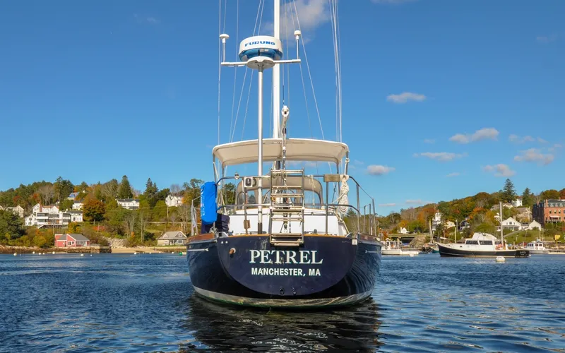Slide: The Image of 1984 Bristol 41.1 | Petrel Sailboat "Petrel" docked in scenic harbor, Bristol 41.1, 1984 model. - 6523149