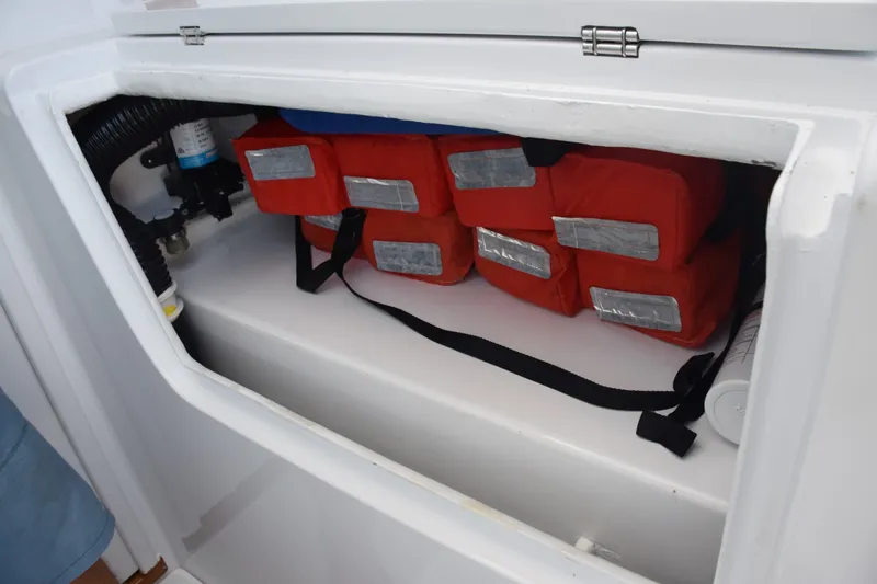 Slide: The Image of Starboard Side Beneath Helm Chair. Life Preserver Storage Above Fuel Tank - 6551296