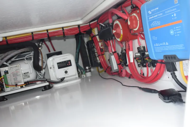 Slide: The Image of Refrigeration And Battery Switches And Charger Under Portside Helm Companion Chair. - 6551289