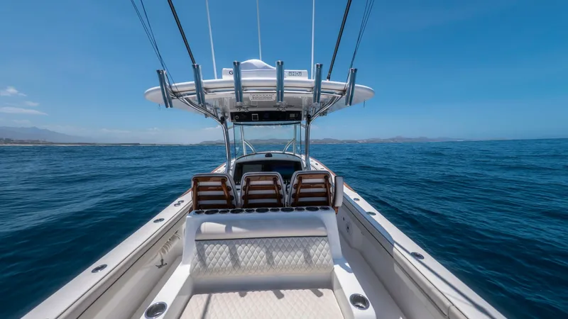 Slide: The Image of Center Console and Seating Area The center console of the 2022 Valhalla Boatworks V-37, 'LONE STAR II,' features a sleek design with ergonomic controls for effortless navigation. The comfortable seating area is equipped with plush, diamond-stitched upholstery, perfect for relaxation dur - 6536765