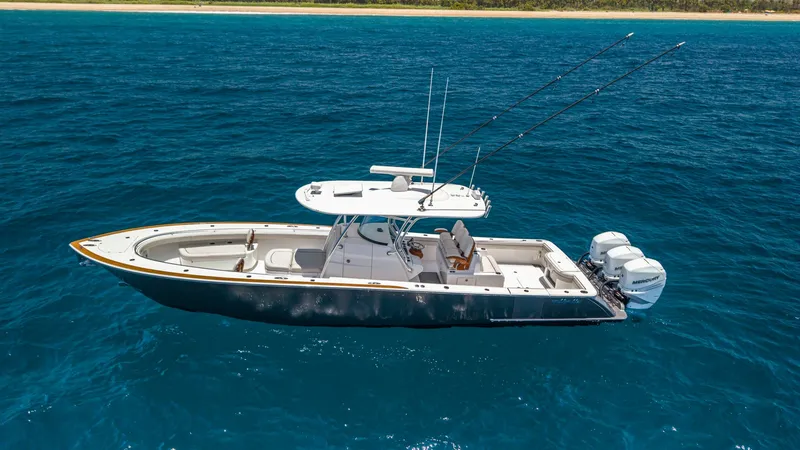 Slide: The Image of Aerial View of Deck and Outboards This image showcases the sleek design of the 2022 Valhalla V-37 by Valhalla Boatworks. The spacious deck is equipped with ample seating and state-of-the-art fishing gear, perfect for both relaxation and adventure. Twin outboard engines provide exceptional - 6536786