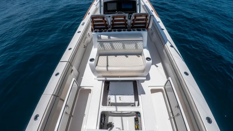 Slide: The Image of Spacious Aft Deck with Seating The aft deck of the 2022 LONE STAR II V-37 by Valhalla Boatworks features a spacious layout with comfortable seating. The area includes luxurious finishes and ample storage compartments, ideal for both relaxation and utility. The sleek design and high-qua - 6536763