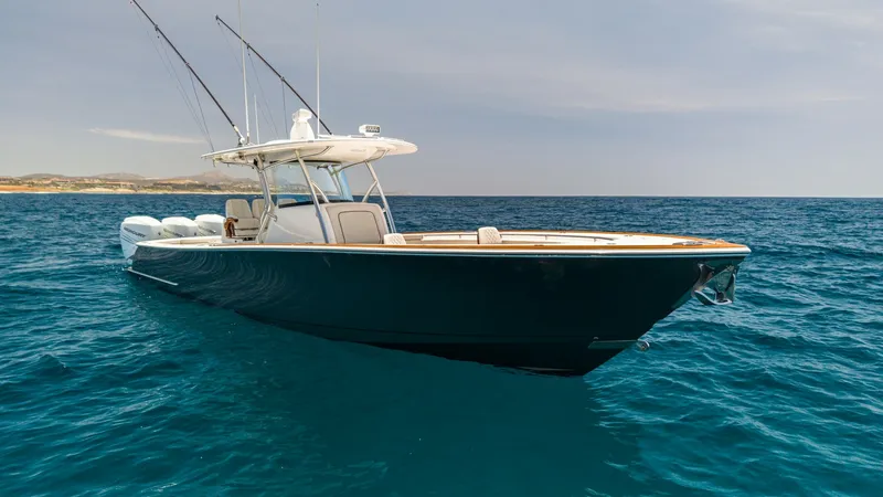 The Image of Starboard Bow View of V-37 The sleek design of the 2022 Valhalla V-37 is showcased in this starboard bow view, highlighting its elegant hull lines and polished finish. The spacious deck area is equipped with robust fishing rods, emphasizing its functionality for avid anglers. The v - 6536760