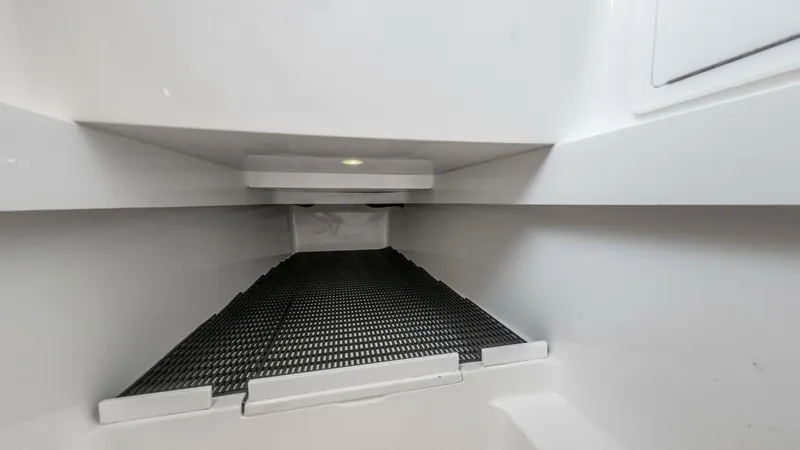 Slide: The Image of Integrated Fishbox Storage Compartment This image showcases the spacious integrated fishbox storage compartment on the LONE STAR II, a 2022 Valhalla V-37. Designed for optimal functionality, the compartment features a non-slip surface and ample space for storing your catch. Its streamlined des - 6536773