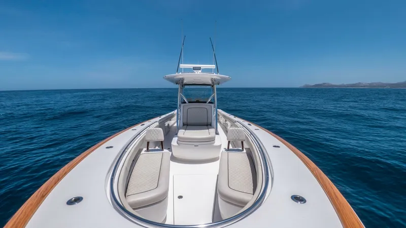 Slide: The Image of Spacious Bow with Sunpad Seating The bow of the 2022 Valhalla V-37, LONE STAR II, offers ample seating with luxurious sunpads, perfect for relaxation. The sleek design features high-quality marine upholstery and teak accents, providing both comfort and style. With clear views of the open - 6536770