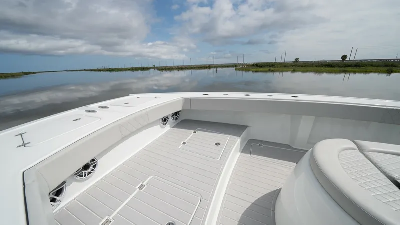 Slide: The Image of Spacious Aft Deck with Seating The aft deck of the 2023 Freeman 42 LR offers an expansive and versatile space, perfect for both relaxation and entertainment. Durable, non-slip flooring and built-in seating ensure comfort and safety, while the sleek white finish enhances the modern aest - 6725111