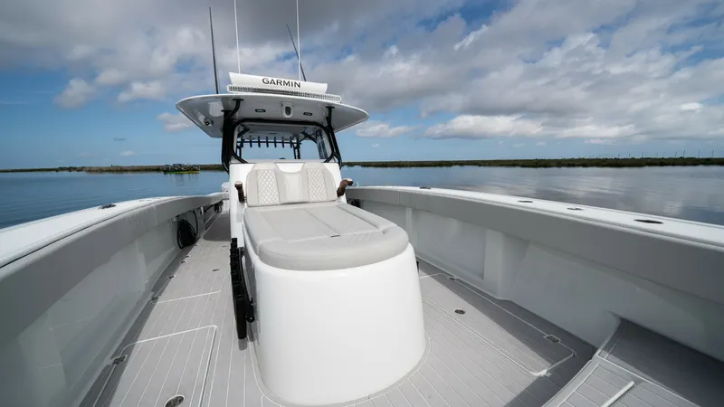 Slide: The Image of Spacious Bow with Sunpad The bow of the Freeman 42 LR features a spacious sunpad perfect for relaxation. Its clean, streamlined design is complemented by durable, high-quality finishes and ample seating. Ideal for taking in serene water views, this area offers both comfort and st - 6725103