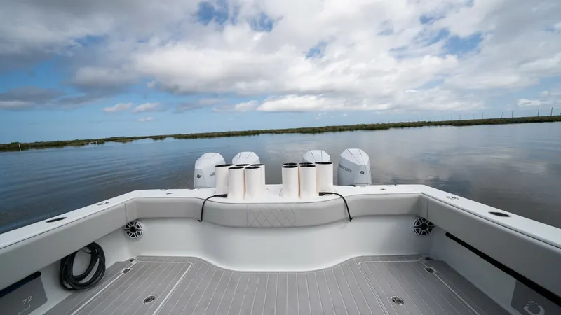 Slide: The Image of Aft Deck with Fishing Rod Holders The aft deck of the 2023 Freeman 42 LR 'Fortunate Son' features a spacious layout ideal for fishing enthusiasts. Equipped with multiple rod holders and a sleek, non-slip deck, it offers both functionality and safety. The area is complemented by powerful o - 6725114