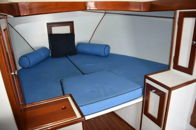 Slide: The Image of Open V Berth With Filler Cushion, Wood Trim - 7384080