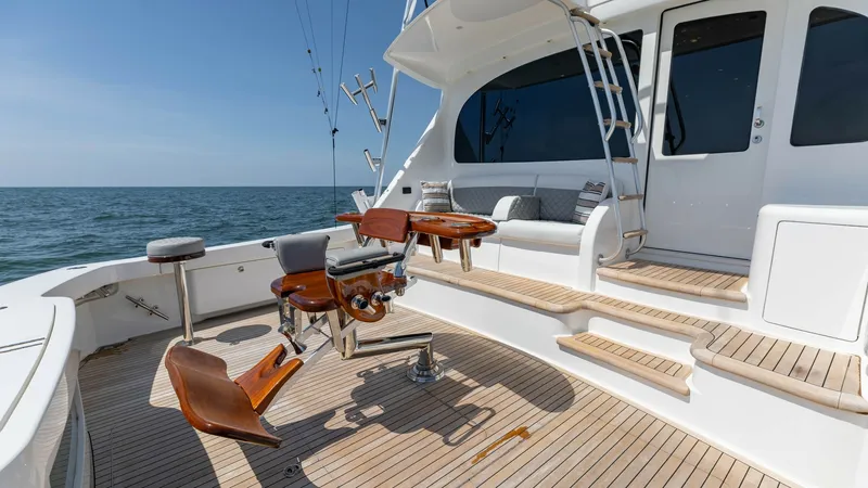 Slide: The Image of Spacious Aft Deck with Fishing Chair The aft deck of the 2020 Viking 62 Convertible features a well-appointed fishing chair, ideal for avid anglers. The teak decking provides a classic and durable finish, while the ample seating and stair access offer comfort and convenience. This area is pe - 6711663