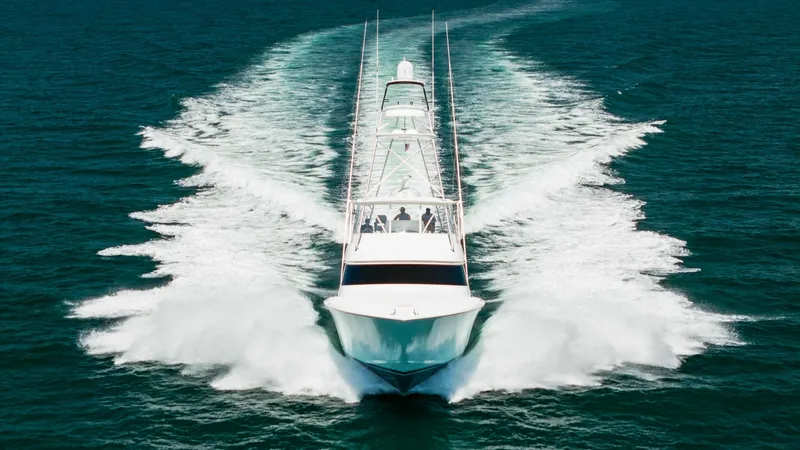 Slide: The Image of Dynamic Bow View Underway The 2020 Viking 62 Convertible showcases its sleek design and powerful performance as it cuts through the water with ease. The dynamic bow view highlights the vessel's robust hull and advanced engineering, emphasizing speed and agility. This image capture - 6711716