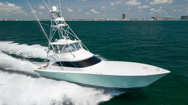 The Image of Viking 62 Convertible Cruising View The 2020 Viking 62 Convertible is captured in motion, showcasing its sleek, aerodynamic hull slicing through the water effortlessly. This powerful sportfishing yacht features a prominent flybridge and tower, ideal for spotting fish and navigating in style - 6711661