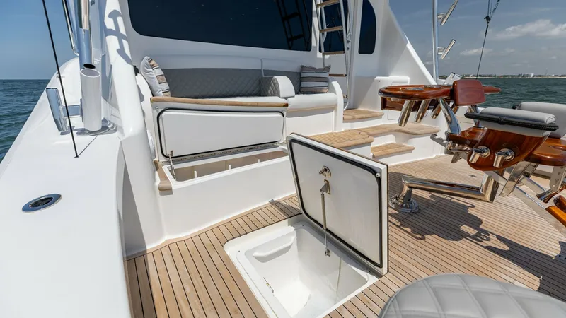 Slide: The Image of Spacious Aft Deck with Seating The aft deck of the 2020 Viking 62 Convertible offers a luxurious space for relaxation and entertainment. Featuring plush seating with accent pillows and a versatile table setup, it is perfect for social gatherings or leisurely afternoons. The high-qualit - 6711701
