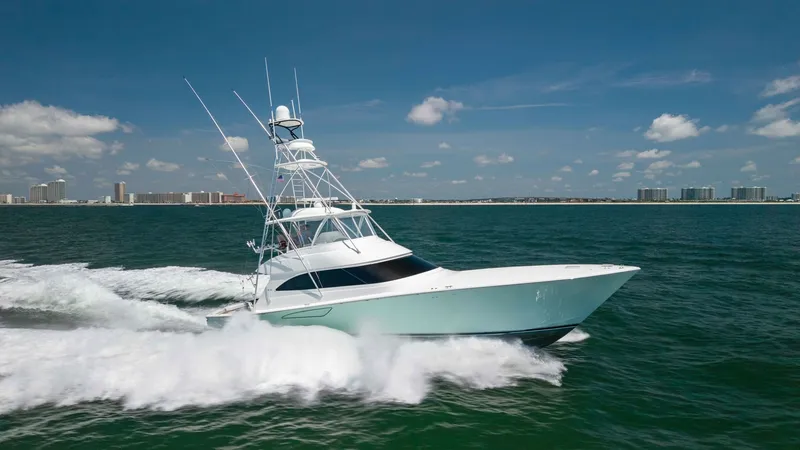 Slide: The Image of Viking 62 Convertible at Sea The 2020 Viking 62 Convertible cuts through the ocean with sleek precision, showcasing its powerful hull and advanced fishing tower. The vessel's aerodynamic design and robust construction ensure optimal performance and stability in open waters. Its elega - 6711715