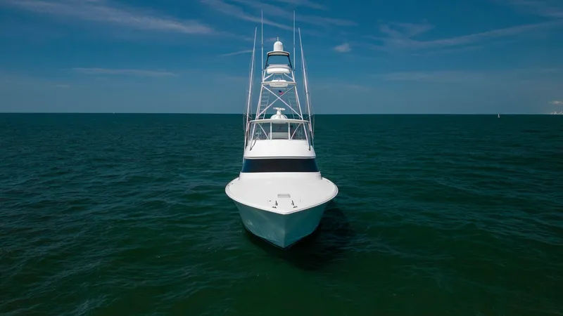 Slide: The Image of Bow View with Tower This striking front view of the 2020 Viking 62 Convertible showcases its sleek bow cutting through the water with precision. The prominent tower offers excellent visibility and enhances the vessel's commanding presence. The elegant lines and robust design - 6711710
