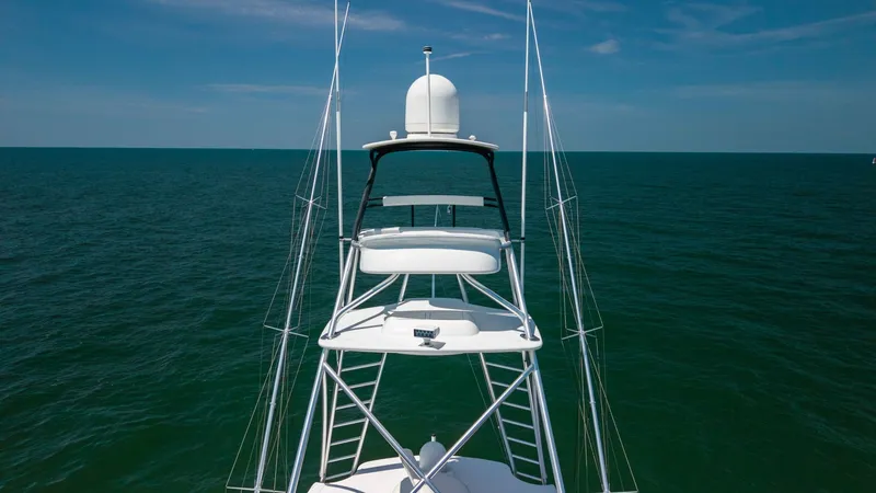 Slide: The Image of Tower View with Ocean Backdrop This image showcases the elevated tower of the 2020 Viking 62 Convertible, offering an expansive view over the open ocean. The sleek design and robust construction highlight the vessel's superior engineering, perfect for both sportfishing and cruising. Th - 6711712