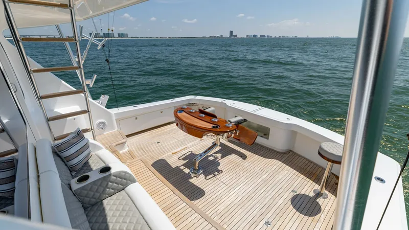 Slide: The Image of Spacious Aft Deck with Fighting Chair The aft deck of the 2020 Viking 62 Convertible features a well-appointed fighting chair, perfect for avid anglers. The teak flooring and comfortable seating with plush cushions provide a luxurious and functional space for relaxing or entertaining. Enjoy p - 6711700