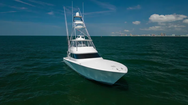 Slide: The Image of Bow View of Viking 62 Convertible This image showcases the sleek bow of the 2020 Viking 62 Convertible, highlighting its aerodynamic design and robust construction. The vessel's expansive foredeck is visible, featuring clean lines and a smooth finish, indicative of Viking's superior craft - 6711709