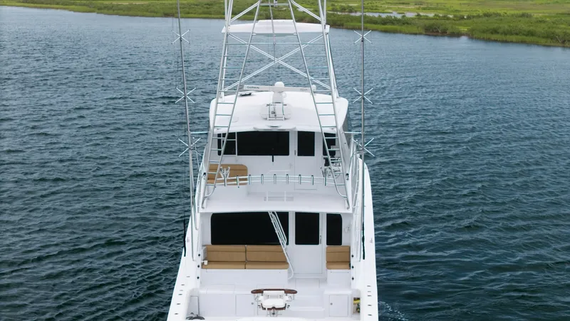 Slide: The Image of Aerial View of Enclosed Bridge This image showcases the Viking 65 Enclosed Bridge from above, highlighting its sleek design and spacious upper deck. The enclosed bridge offers panoramic views and protection from the elements, making it ideal for all-weather navigation. The aft deck bel - 6767210