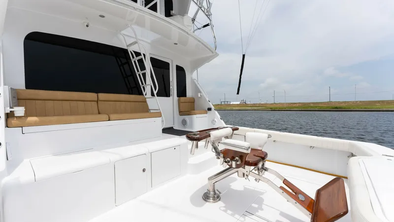 Slide: The Image of Spacious Aft Deck with Seating The aft deck of the Viking 65 Enclosed Bridge features ample seating with plush cushions, offering comfort and style for your cruising experience. The deck is equipped with a sturdy fighting chair, ideal for fishing enthusiasts. Its seamless design and op - 6767192