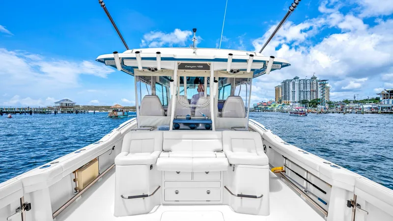 Slide: The Image of Spacious Aft Deck with Seating The aft deck of the 2021 Grady-White Canyon 456 offers ample seating and storage, perfect for both relaxation and fishing activities. The sleek white finish and ergonomic design provide comfort and style, while the rod holders and abundant deck space cate - 6725176