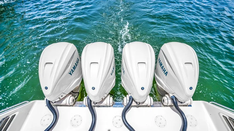 Slide: The Image of Quad Yamaha Outboard Engines This image showcases the powerful quad Yamaha outboard engines on the Grady-White Canyon 456. These engines provide exceptional performance and reliability, making them ideal for both cruising and fishing. The sleek design and robust construction ensure a - 6725190
