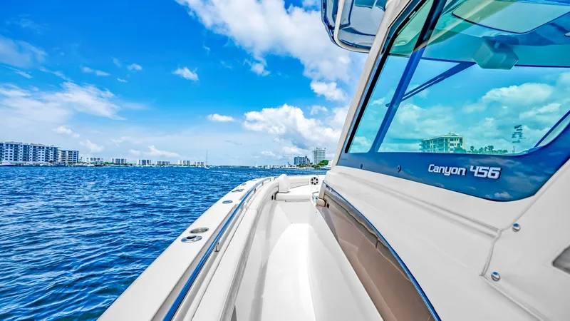 Slide: The Image of Starboard Side Deck with Panoramic Views The starboard side deck of the 2021 Grady-White Canyon 456 offers expansive views, perfect for enjoying scenic waterways. The sleek hull design and modern lines are complemented by durable materials and high-quality finishes. This area provides easy acces - 6725182