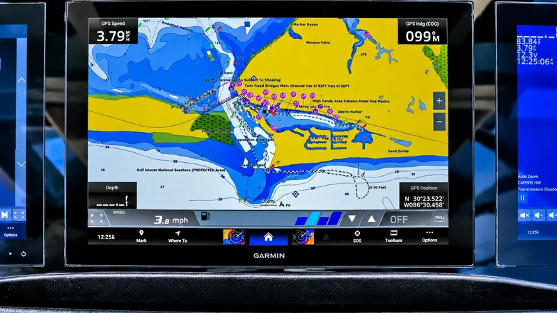 Slide: The Image of State-of-the-Art Navigation Display The navigation console of the Grady-White Canyon 456 showcases a high-resolution Garmin display, providing precise GPS speed and location details. This advanced system enhances safety and ease of navigation with its intuitive interface and comprehensive m - 6725161