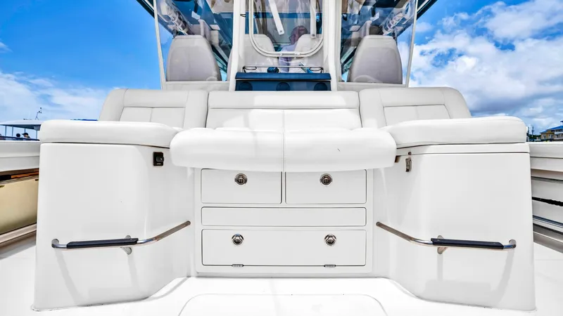 Slide: The Image of Center Console Seating and Storage This image showcases the sleek and functional center console area of the Grady-White Canyon 456. The spacious seating is upholstered in premium materials, offering comfort and style, while the integrated storage drawers provide practical functionality. Th - 6725175