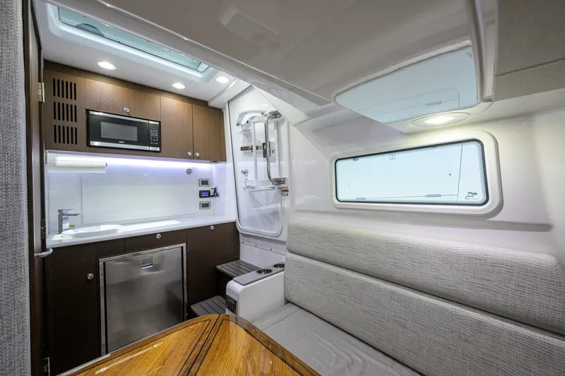 Slide: The Image of Everglades 45 GALLANT LADY - Cabin Entrance & Galley 2023 Everglades 455 Center Console GALLANT LADY - 7656330