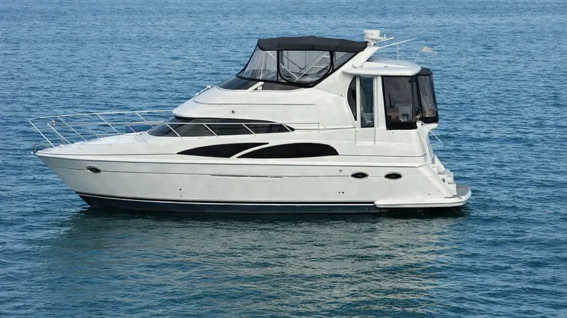 The Image of Side Profile of Carver 396 Motor Yacht The 2006 Carver 396 Motor Yacht, Serendipity, is elegantly displayed in this side profile view, showcasing its sleek lines and spacious flybridge. The vessel's distinctive black and white color scheme enhances its modern aesthetic, while large windows pro - 8273152