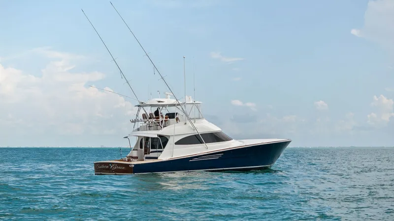 Slide: The Image of Profile View of 64 Convertible Yacht The 2024 Viking 64 Convertible, Southern Grace, showcases its sleek profile and robust design on open waters. With a striking hull and a spacious flybridge, this vessel is built for both luxury and functionality. The elegant lines and high-quality craftsm - 7541894