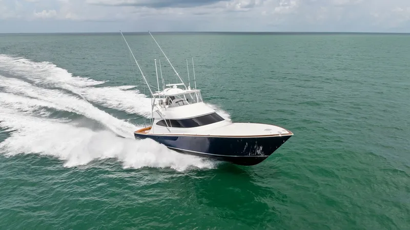 Slide: The Image of Dynamic Bow View at Sea The 2024 Viking 64 Convertible, 'Southern Grace,' cuts through the waves with sleek precision, showcasing its robust hull and streamlined design. The vessel's powerful stance and elegant profile are highlighted against the open sea, emphasizing its perfor - 7541897