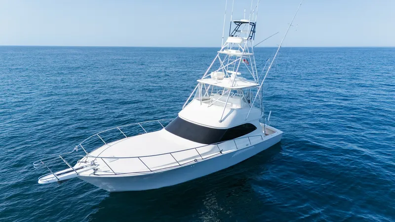 Slide: The Image of 2009 Viking 50 Convertible " Jammin" This image showcases the sleek bow and elevated flybridge of the 2009 Viking 50 Convertible. The vessel's aerodynamic shape and sturdy railings provide both style and safety. The expansive flybridge offers excellent visibility for navigation, making it id - 7018176