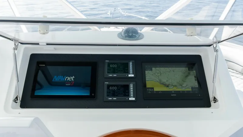 Slide: The Image of 2009 Viking 50 Convertible "Jammin" - Helm Station with Navigation Displays This helm station on the 2009 Viking 50 Convertible features state-of-the-art navigation displays, providing comprehensive control and information at your fingertips. The sleek, integrated screens offer clear visibility of navigation maps and system metri - 7018186