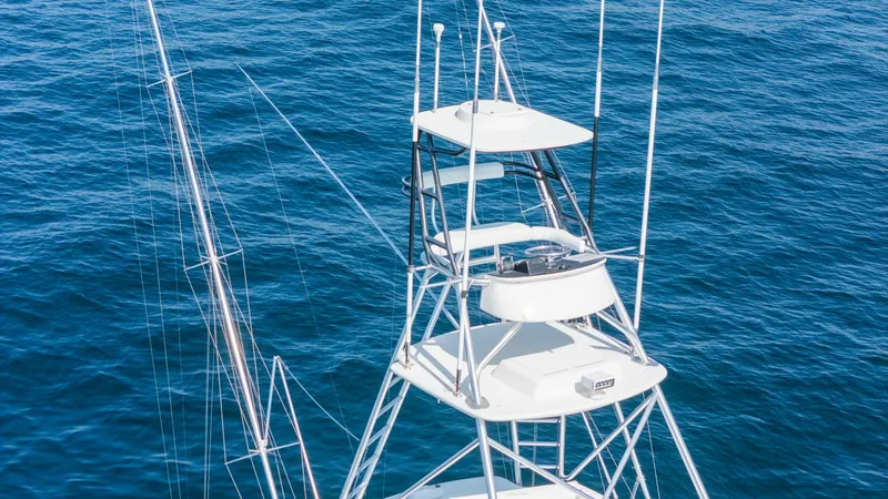 Slide: The Image of 2009 Viking 50 Convertible "Jammin" - Tower Provides Excellent Visibility for Navigation and Fishing. The Viking 50 Convertible's tower offers an elevated helm station, providing excellent visibility for navigating and spotting fish. Its sleek, sturdy design is equipped with essential controls and instrumentation, ensuring a commanding presence on the wat - 7018172