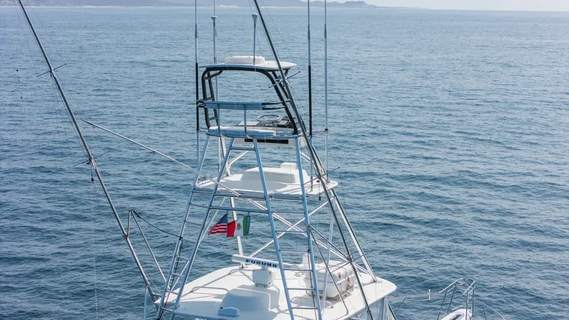 Slide: The Image of 2009 Viking 50 Convertible "Jammin" - Tower Provides Excellent Visibility for Navigation and Fishing. This image captures the tower and upper helm station of the 2009 Viking 50 Convertible, Jammin. The sturdy tower provides excellent visibility for navigation and fishing, equipped with advanced electronics and controls. Its sleek design is complemented by - 7018177